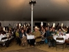 Rotating image:  Everyone raising their paddles high during the Paddles Up portion of the live auction