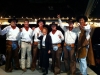 Auctioneer Gayle Stallings with the University of Texas Cowboys as bid spotters